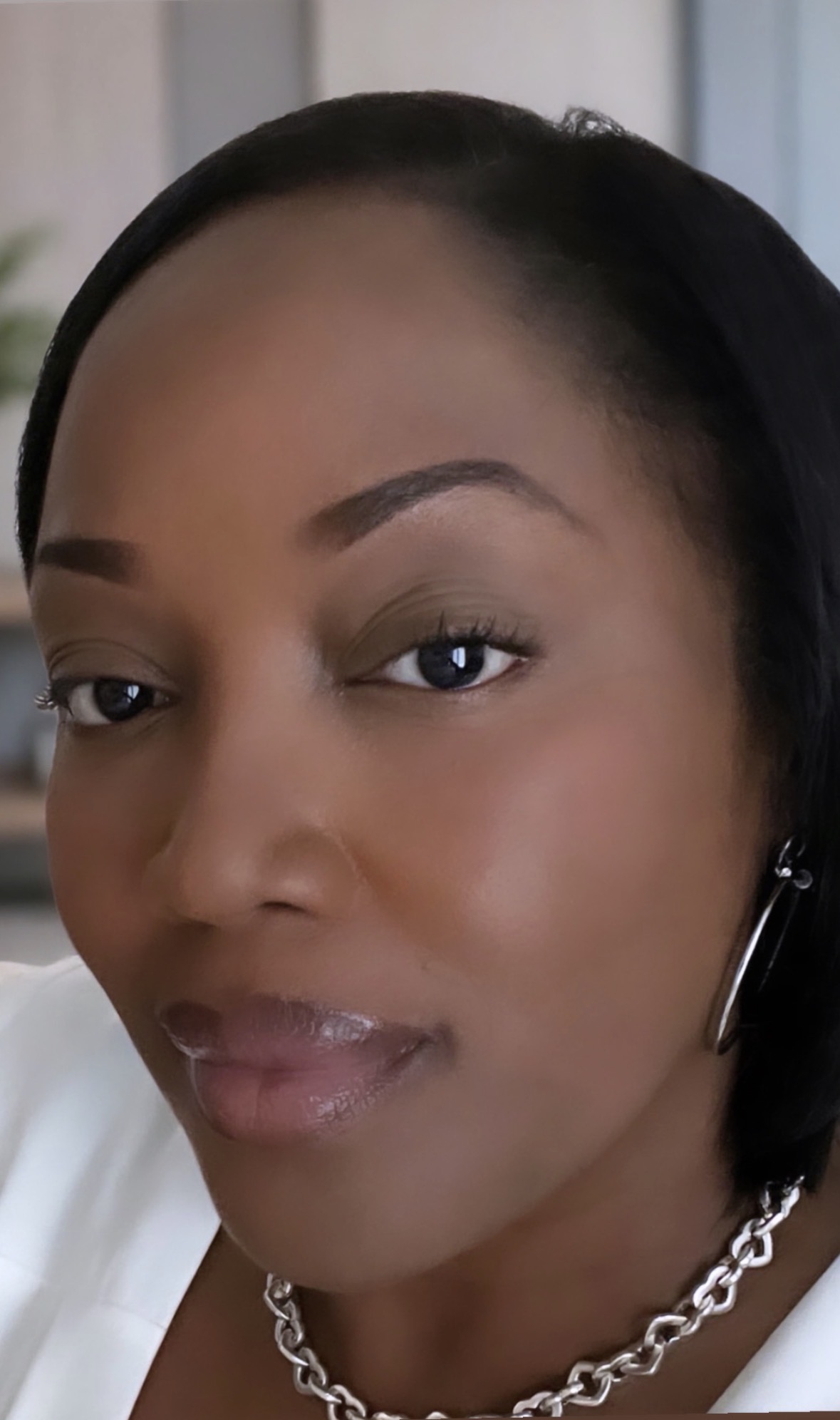 Portrait of Makeda Davis wearing a white shirt